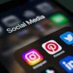 A smartphone screen displaying popular social media applications like Instagram and Twitter.